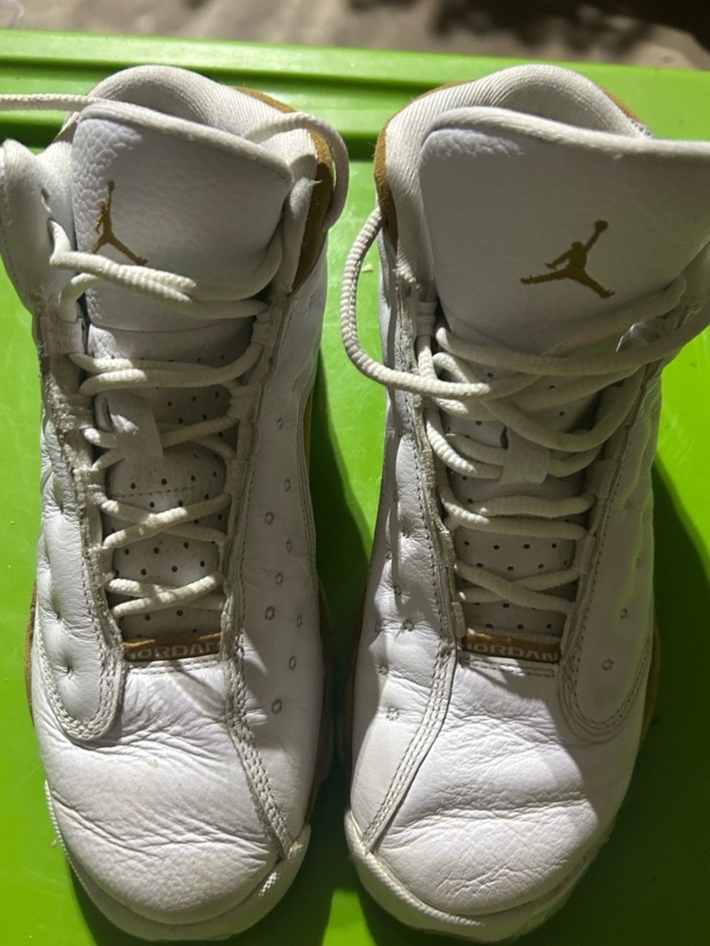 Jordan White and Gold Low-Top Sneakers